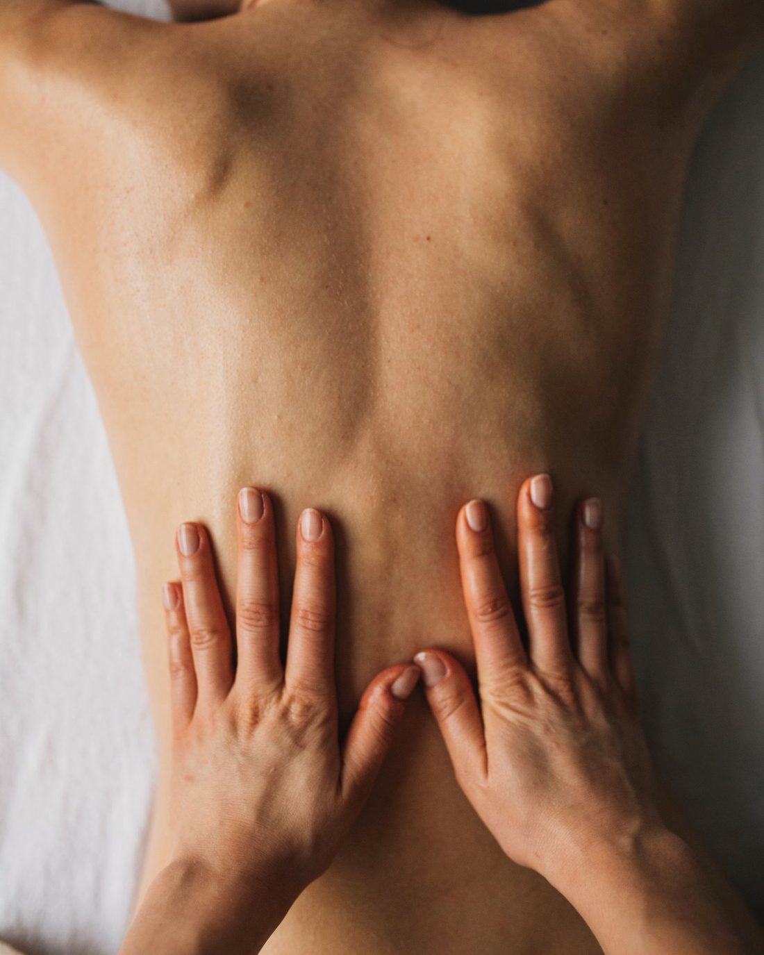 Remedial massage on the upper back and shoulders